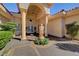 Inviting home exterior featuring a tiled roof, statue accent, and covered entryway at 4936 Mountain Foliage Dr, Las Vegas, NV 89148