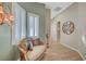 Hallway seating area with window shutters, light fixture, and wood floor at 4936 Mountain Foliage Dr, Las Vegas, NV 89148