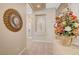Elegant hallway featuring a decorative alcove with a statue and a view into other rooms, enhancing its charm at 4936 Mountain Foliage Dr, Las Vegas, NV 89148