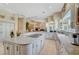 Open-concept kitchen with granite countertops, island cooktop, and custom cabinetry, perfect for entertaining and cooking at 4936 Mountain Foliage Dr, Las Vegas, NV 89148