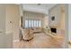 Bright living room featuring a fireplace, shutters, and cozy seating arrangement at 4936 Mountain Foliage Dr, Las Vegas, NV 89148
