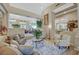 Inviting living room with stepped floorplan, comfortable seating, and an open view to dining at 4936 Mountain Foliage Dr, Las Vegas, NV 89148