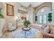 Elegant living room with soaring ceilings, decorative pillars, and ample natural light creating a grand atmosphere at 4936 Mountain Foliage Dr, Las Vegas, NV 89148