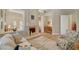 Open-concept living room with fireplace, wood floors, and neutral color palette at 4936 Mountain Foliage Dr, Las Vegas, NV 89148