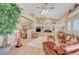 Inviting living room boasting built-in shelving, a fireplace, and seamless flow to a dining area, perfect for gatherings at 4936 Mountain Foliage Dr, Las Vegas, NV 89148