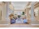 Spacious living room with decorative columns, neutral color palette, and an open floor plan at 4936 Mountain Foliage Dr, Las Vegas, NV 89148