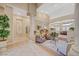 Stylish living room with decorative columns, built-in shelving, and marble flooring at 4936 Mountain Foliage Dr, Las Vegas, NV 89148