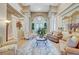 Bright living room showcasing soaring ceilings, pillars, and an open layout with a seamless flow for entertaining at 4936 Mountain Foliage Dr, Las Vegas, NV 89148