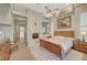 Comfortable main bedroom with fireplace, wood floors, and natural light from windows at 4936 Mountain Foliage Dr, Las Vegas, NV 89148