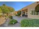 Beautiful patio with desert landscaping, mature trees, and stucco home exterior at 4936 Mountain Foliage Dr, Las Vegas, NV 89148