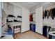 A spacious walk-in closet with custom white shelving and wood flooring at 4936 Mountain Foliage Dr, Las Vegas, NV 89148