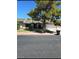 Inviting single-story home with mature landscaping and a driveway leading to the garage at 5612 Pearldrop Ave, Las Vegas, NV 89107