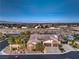 Expansive aerial view showcases the property's pool, putting green, and neighborhood at 5640 Willow Canyon St, Las Vegas, NV 89149