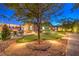 This backyard showcases a putting green, patio seating, string lights, and desert landscaping at 5640 Willow Canyon St, Las Vegas, NV 89149