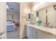 Bathroom with double granite vanity, with access to bedroom at 5640 Willow Canyon St, Las Vegas, NV 89149