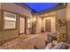 Charming courtyard featuring brick flooring, comfortable seating, and decorative floral arrangements at 5640 Willow Canyon St, Las Vegas, NV 89149