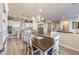 Elegant dining room with view into a gourmet kitchen with stainless steel appliances at 5640 Willow Canyon St, Las Vegas, NV 89149