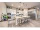 Beautiful kitchen with stainless steel appliances, tile backsplash, and large granite island at 5640 Willow Canyon St, Las Vegas, NV 89149
