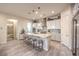 Bright kitchen with stainless steel appliances, granite countertops, and island seating at 5640 Willow Canyon St, Las Vegas, NV 89149