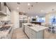 Open kitchen featuring stainless appliances, granite counters, breakfast bar, and dining area at 5640 Willow Canyon St, Las Vegas, NV 89149