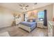 Bright main bedroom features a ceiling fan, tiled floors, and white furniture at 5640 Willow Canyon St, Las Vegas, NV 89149