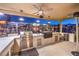 Outdoor kitchen featuring built-in BBQ and bar with sink, ideal for entertaining friends and Gathering at 5640 Willow Canyon St, Las Vegas, NV 89149