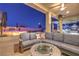 Inviting outdoor space with comfortable seating around a fire pit, perfect for relaxing and entertaining at 5640 Willow Canyon St, Las Vegas, NV 89149