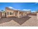 Spacious backyard with a covered patio and low-maintenance landscaping at 6217 Statue St, North Las Vegas, NV 89081