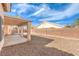 Well-kept backyard with a covered patio and block wall fence for privacy at 6217 Statue St, North Las Vegas, NV 89081