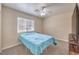 Bedroom featuring large window and neutral walls and carpet at 6217 Statue St, North Las Vegas, NV 89081