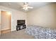Bright bedroom with ceiling fan and neutral walls and carpet at 6217 Statue St, North Las Vegas, NV 89081