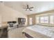 Spacious bedroom with a ceiling fan and a cozy window seat at 6217 Statue St, North Las Vegas, NV 89081
