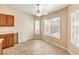 Cozy breakfast nook area with a ceiling fan, bright windows, and tile flooring for a comfortable feel at 6217 Statue St, North Las Vegas, NV 89081