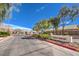 A sunny day view of the Sunny Brook community entrance with manicured landscaping and a clear blue sky at 6217 Statue St, North Las Vegas, NV 89081