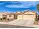 Beautiful one-story home with a stucco exterior, tile roof, and a spacious two-car garage at 6217 Statue St, North Las Vegas, NV 89081