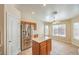 Kitchen with a stainless steel refrigerator and a central island at 6217 Statue St, North Las Vegas, NV 89081