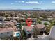 Aerial view of a home in a residential neighborhood with the Las Vegas Strip in the distance at 640 Hayborn Meadows St, Las Vegas, NV 89138