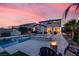 Beautiful backyard oasis featuring a pool, spa, and fire pit at 640 Hayborn Meadows St, Las Vegas, NV 89138