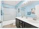 Bathroom with double sink, tub, and blue walls at 640 Hayborn Meadows St, Las Vegas, NV 89138