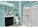 Modern bathroom with white subway tile shower and gray wood-look flooring at 640 Hayborn Meadows St, Las Vegas, NV 89138
