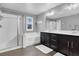 Bright bathroom with a glass shower, soaking tub, and double vanity at 640 Hayborn Meadows St, Las Vegas, NV 89138