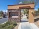 Stone community entrance sign for Andorra with decorative lighting and landscaping at 640 Hayborn Meadows St, Las Vegas, NV 89138