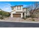 Charming two-story home with a well-maintained lawn, brick driveway, and a welcoming front entrance at 640 Hayborn Meadows St, Las Vegas, NV 89138