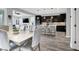 Modern eat in kitchen with white countertops, stainless steel appliances, island seating, dining room, and open layout at 640 Hayborn Meadows St, Las Vegas, NV 89138
