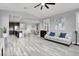 Spacious living room with open floor plan, flowing into the kitchen and dining areas with tile flooring throughout at 640 Hayborn Meadows St, Las Vegas, NV 89138