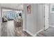 Open-concept living space with bar seating, tile floors, and plenty of natural light at 640 Hayborn Meadows St, Las Vegas, NV 89138