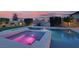Modern pool and spa with LED lighting in a landscaped backyard at 640 Hayborn Meadows St, Las Vegas, NV 89138
