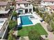 Aerial view of a backyard featuring a pool, spa, patio, and well-maintained landscaping at 640 Hayborn Meadows St, Las Vegas, NV 89138