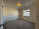 This bedroom has neutral carpet, white walls, and natural light from one window at 6546 Churnet Valley Ave, Las Vegas, NV 89139