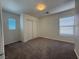 This bedroom has neutral carpet, white walls, and natural light from two windows at 6546 Churnet Valley Ave, Las Vegas, NV 89139